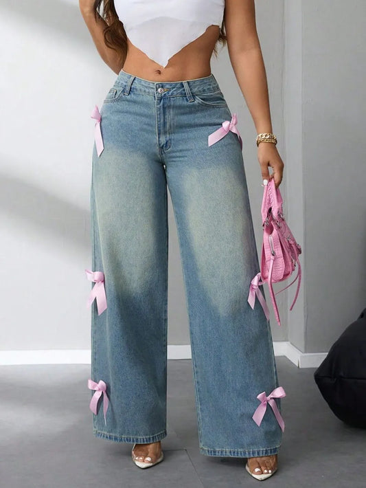 Model wearing high-rise wide leg jeans with bow detail at waist – ODI-ONE FASHION