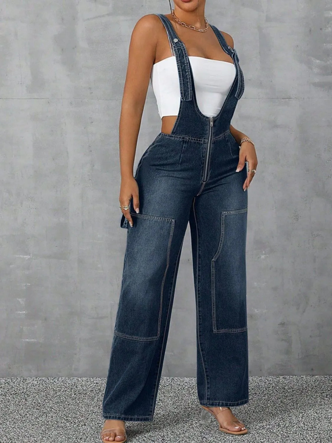 Confident woman in wide-strap zip-front denim overalls – ODI-ONE FASHION
