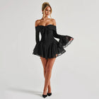 Chic minimalist black playsuit styled with heels