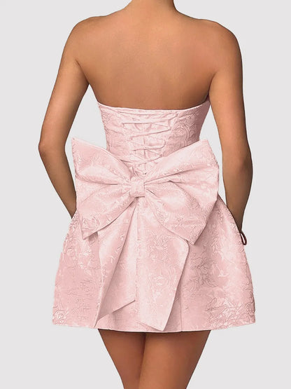 Close-up of shiny satin fabric and bow detail Chic Bow Mini