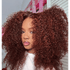 Woman with voluminous curly hair in a casual setting
