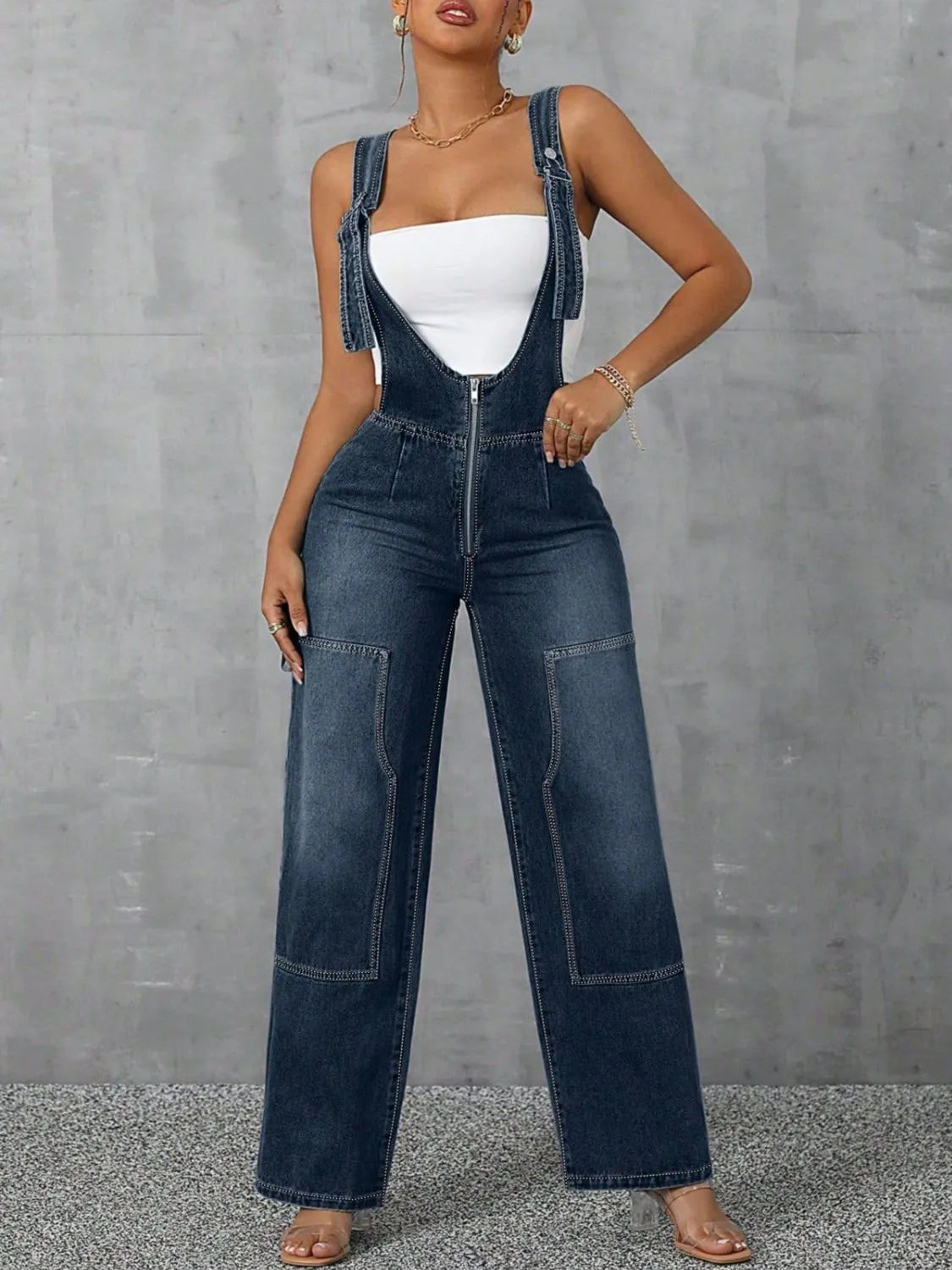 Confident woman in wide-strap zip-front denim overalls – ODI-ONE FASHION
