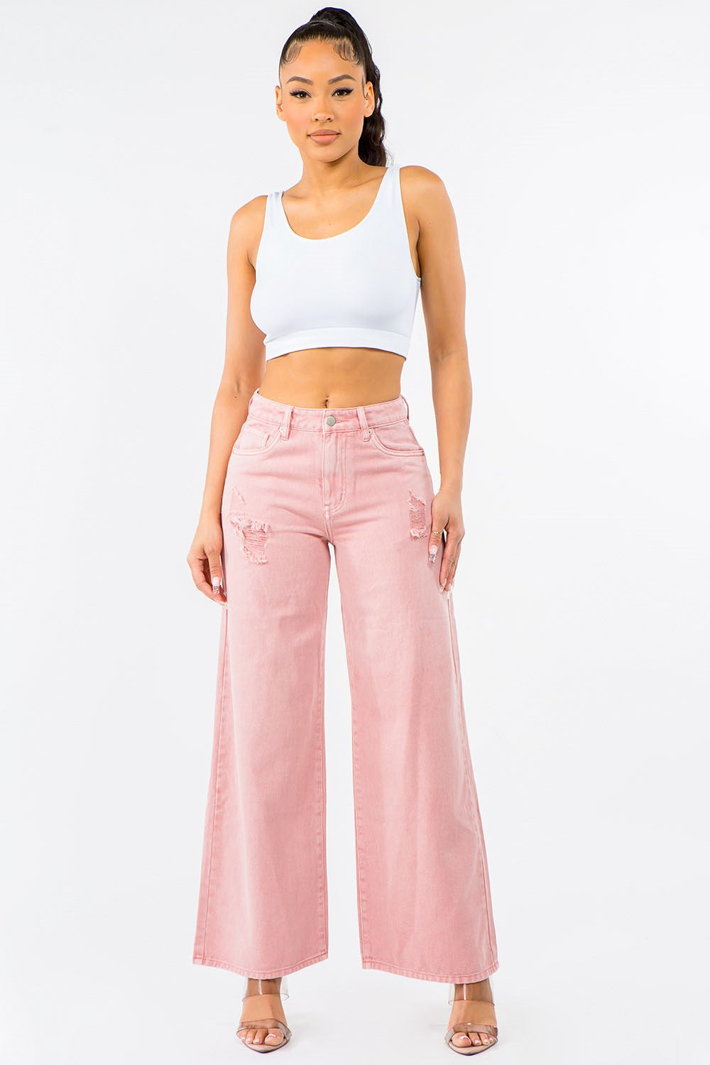 Model wearing high-waisted distressed wide leg jeans – ODI-ONE FASHION street style
