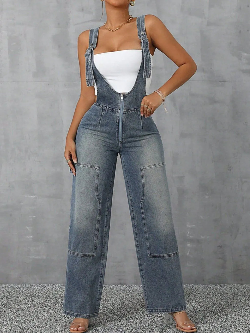 Confident woman in wide-strap zip-front denim overalls – ODI-ONE FASHION
