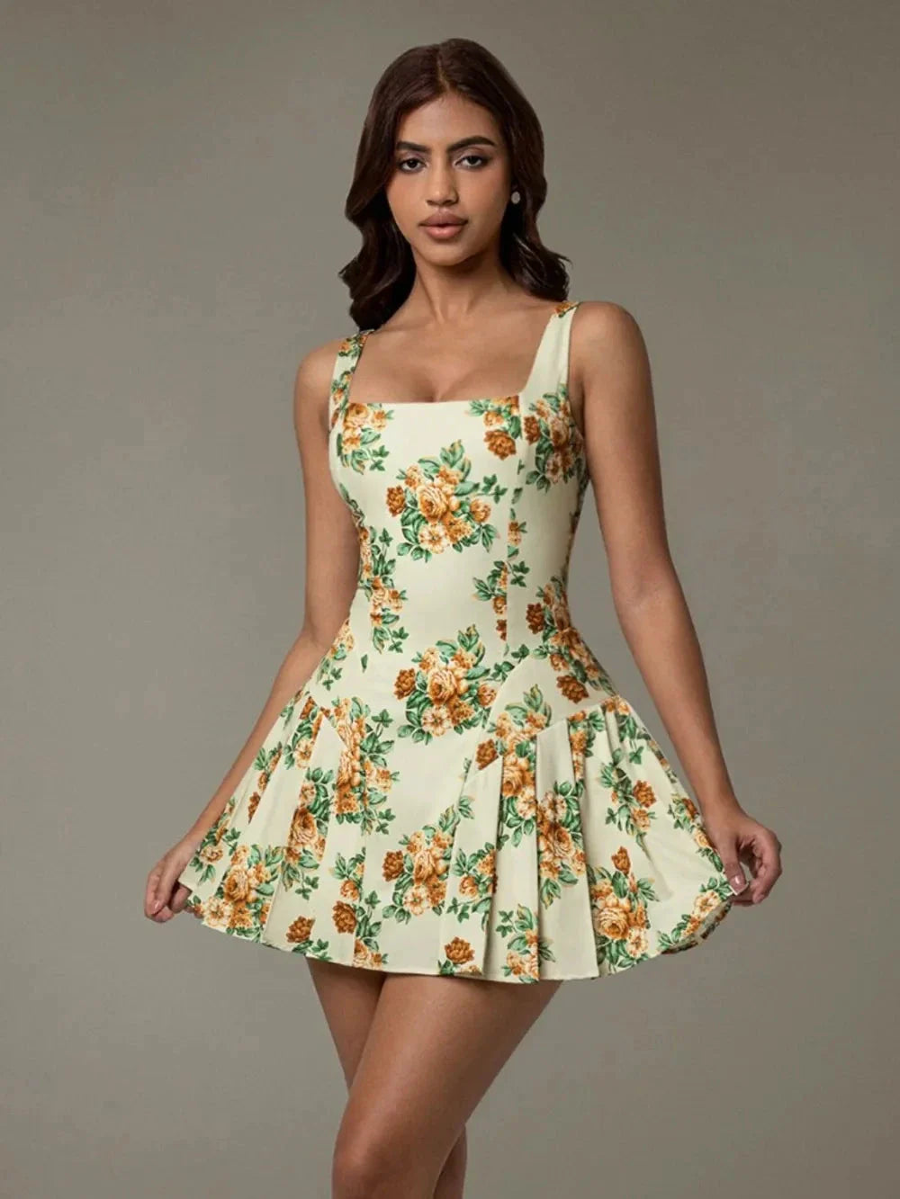 Chic woman walking in a garden wearing Blossom Breeze floral mini dress – casual summer style Blossom Breeze Mini Dress