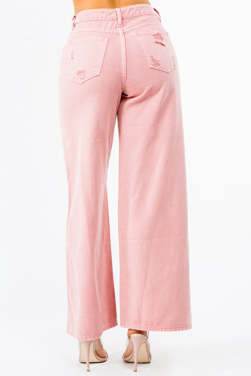 Model wearing high-waisted distressed wide leg jeans – ODI-ONE FASHION street style
