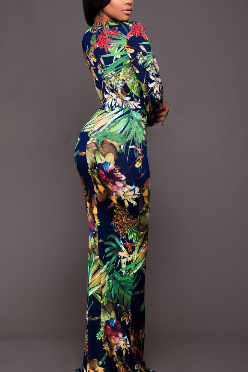 Back view of lightweight tropical glow dress on model