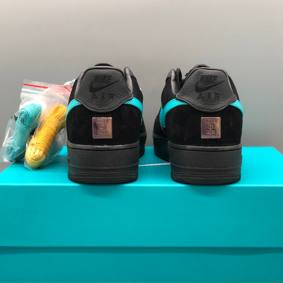 alt="Nike Air Force 1 Low Tiffany &amp; Co. 1837 Black Blue DZ1382-001 Sneakers Side View"
alt="Nike Air Force 1 Tiffany &amp; Co. Black Blue Limited Edition Luxury Sneakers"
alt="Nike Tiffany Air Force 1 1837 Black Blue Premium Suede Leather Design"
alt="Nike Air Force 1 Tiffany &amp; Co. Sneakers with Tiffany Blue Accents"
