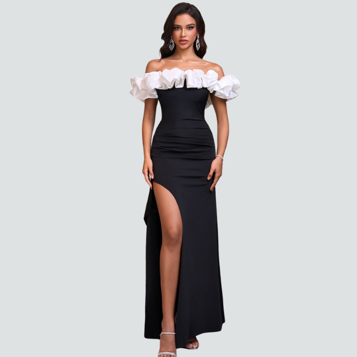 Model wearing Noirel black and white maxi dress – full length elegance | ODI-ONE FASHION
