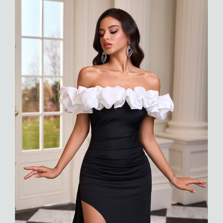 Model wearing Noirel black and white maxi dress – full length elegance | ODI-ONE FASHION
