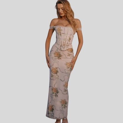 Model in Amara vintage-print off-shoulder maxi dress"