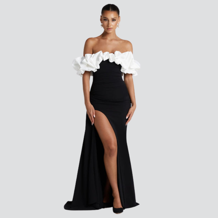 Model wearing Noirel black and white maxi dress – full length elegance | ODI-ONE FASHION
