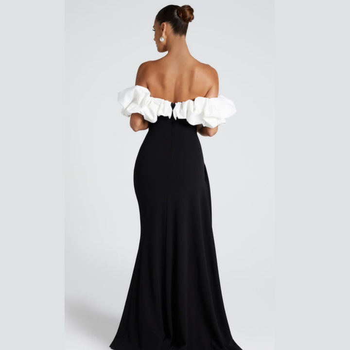 Model wearing Noirel black and white maxi dress – full length elegance | ODI-ONE FASHION
