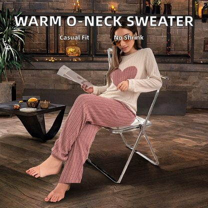 Woman wearing a warm o-neck sweater and pink pants sitting on a chair indoors.