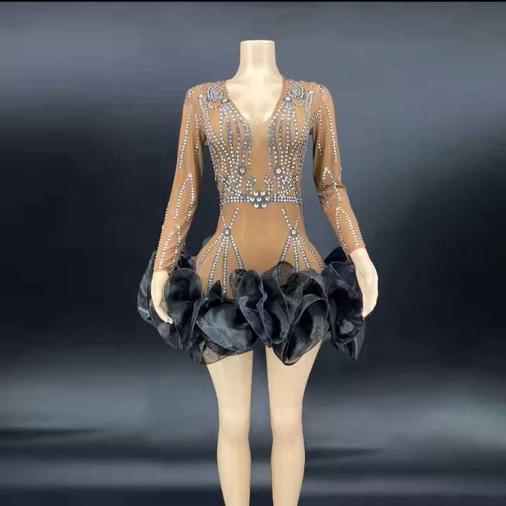 Close-up of sheer mesh sleeves on elegant black V-neck dress Elegant Sheer Panel