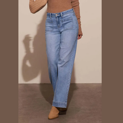 Model wearing high-rise wide leg jeans with front pockets