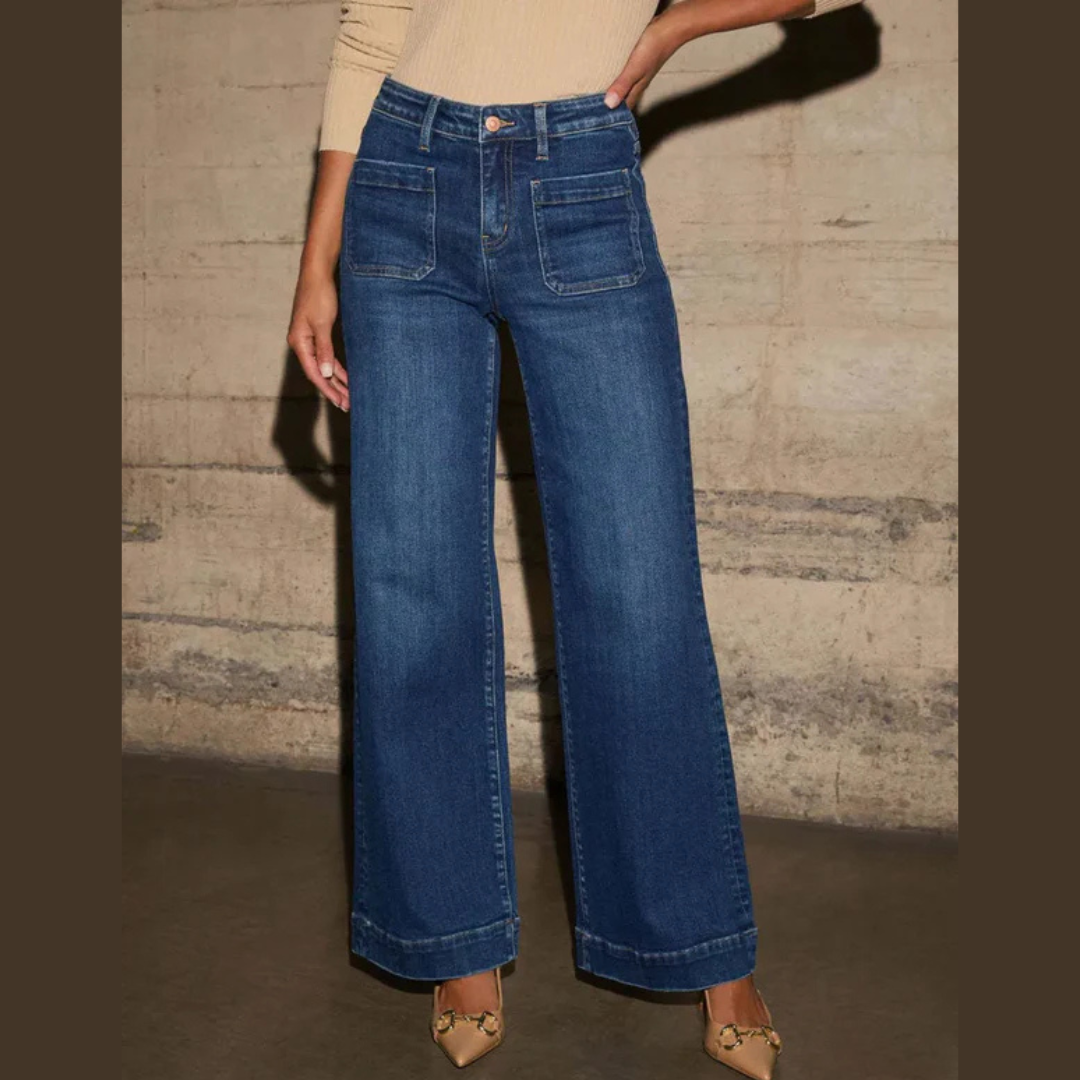 Model wearing high-rise wide leg jeans with front pockets