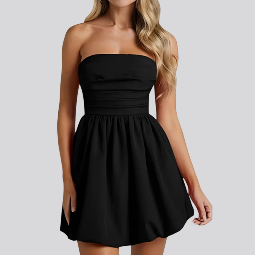 Model in ruched strapless mini dress, front view  