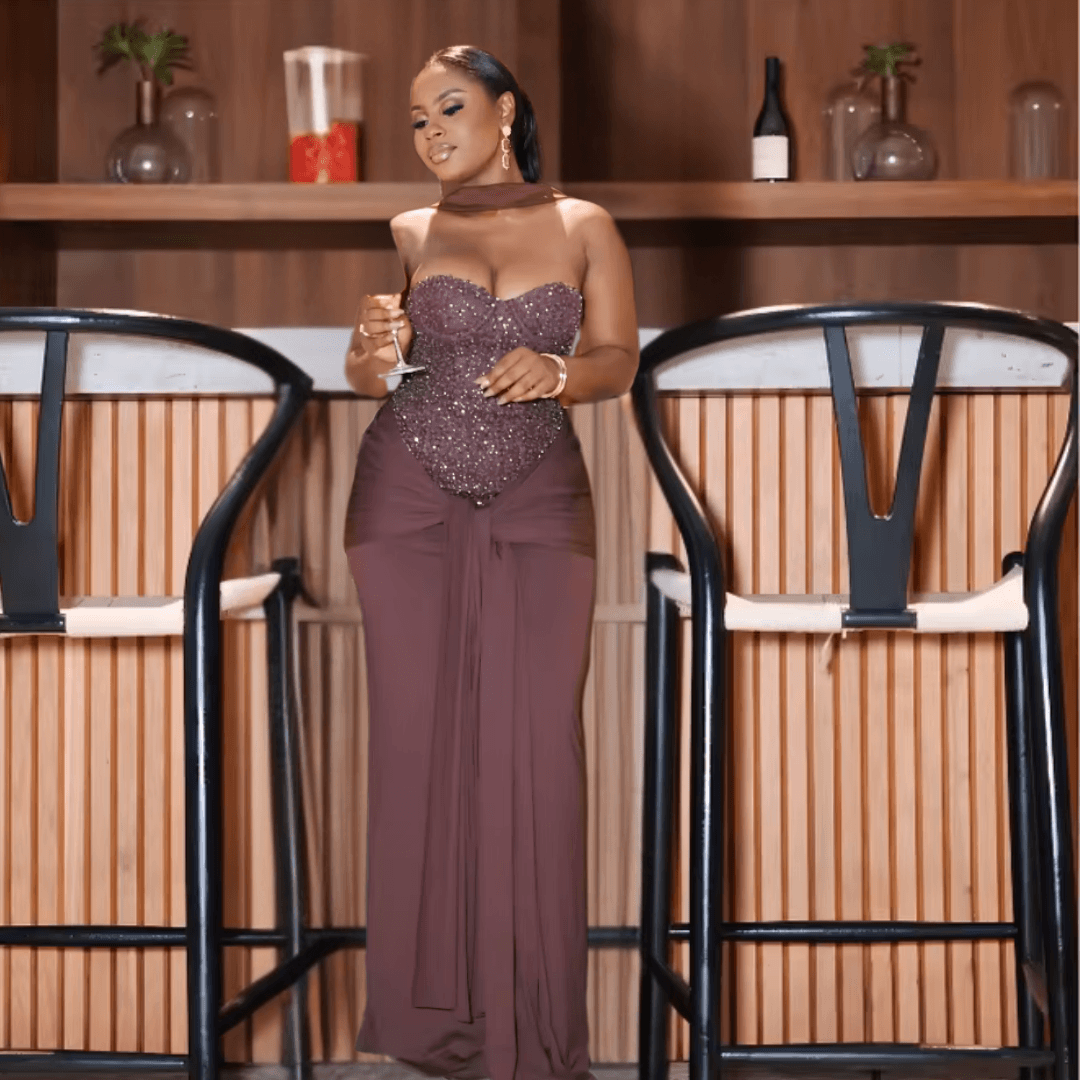 Model wearing Aurelia plum brown satin maxi dress
