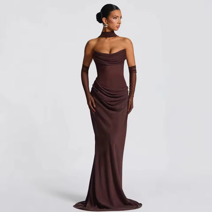 Model wearing Seraphina strapless backless maxi dress with gloves and scarf
