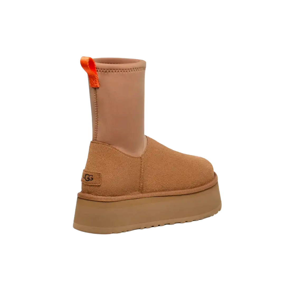 Tan platform boot with orange tag on a white background