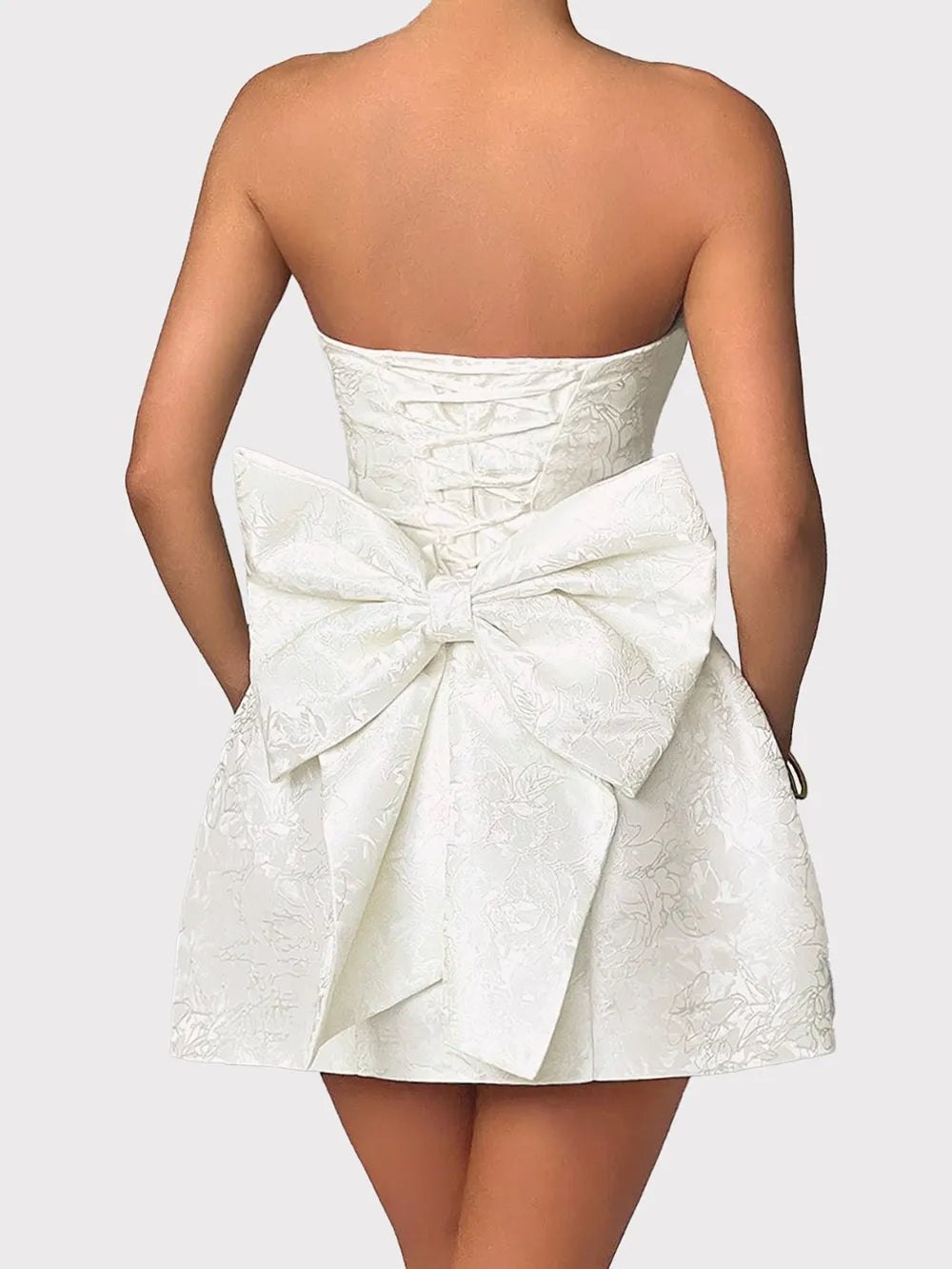 Back view of lace-up satin mini dress with sleeveless design Silky Desire Dress