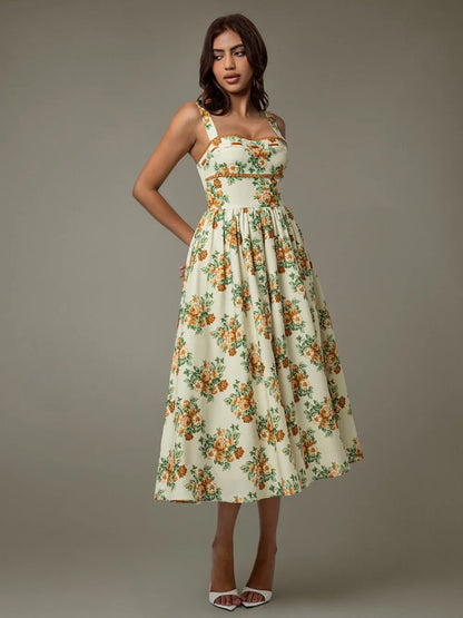 Side profile of sleeveless floral midi dress with lace trim – summer elegance
