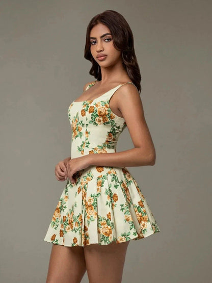 Chic woman walking in a garden wearing Blossom Breeze floral mini dress – casual summer style Blossom Breeze Mini Dress