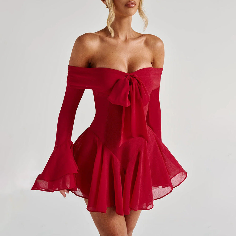 Model walking confidently in red playsuit  