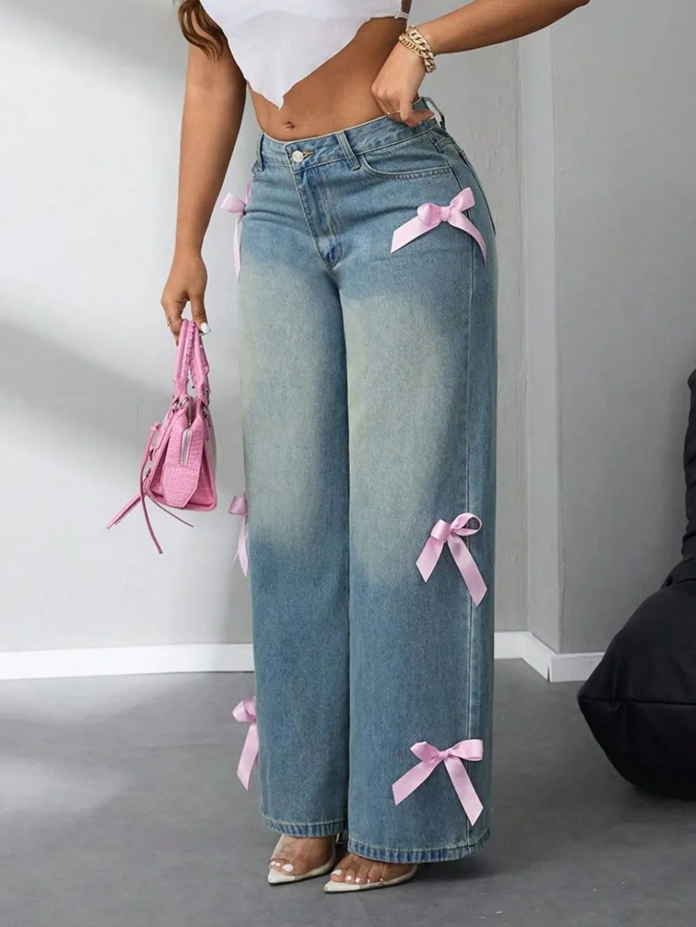 Model wearing high-rise wide leg jeans with bow detail at waist – ODI-ONE FASHION