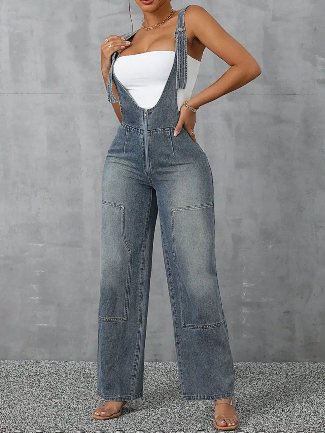 Confident woman in wide-strap zip-front denim overalls – ODI-ONE FASHION
