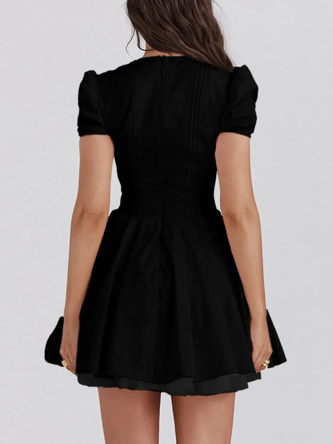 Model showing off casual chic look in V-neck mini dress Effortless Chic Dress