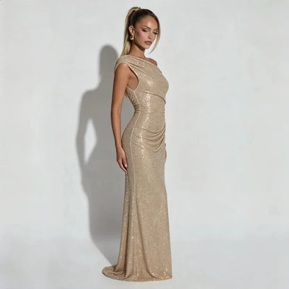 Elegant gold maxi dress on a model, showcasing its stunning floor-length silhouette and sophisticated design.