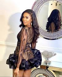 Back view of fitted short black dress with sheer long sleeves Elegant Sheer Panel