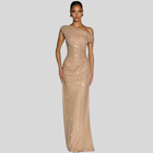Elegant gold maxi dress featuring a stunning floor-length silhouette with a one-shoulder design and shimmering details.